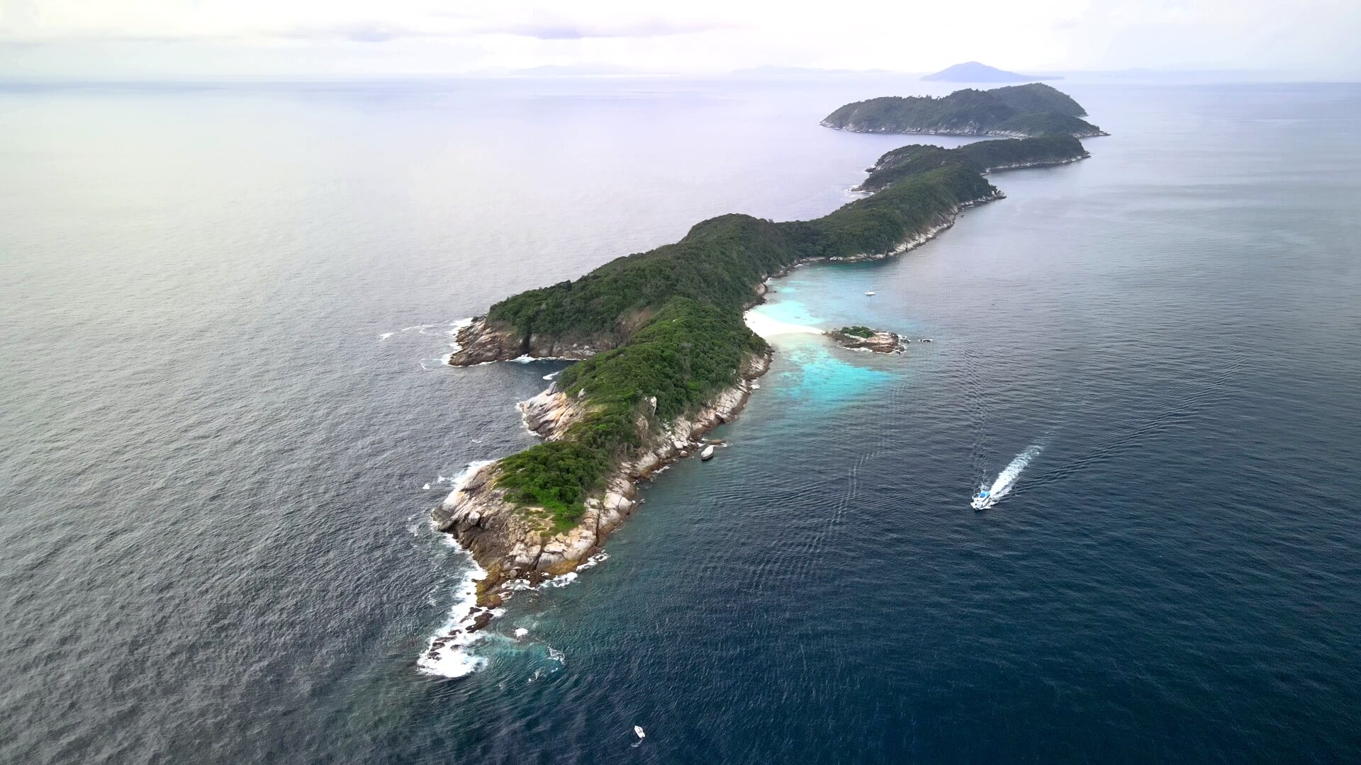 racha noi lies north to south allowing access in the best diving season in phuket and low season