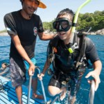 Happy customer returning after an amazing scuba dive with Local Dive Thailand